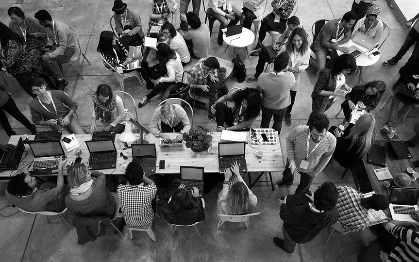 Large team collaborating in a workspace