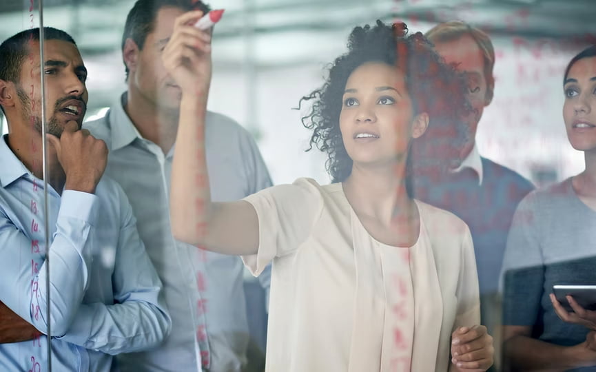 Leader with marker at whiteboard